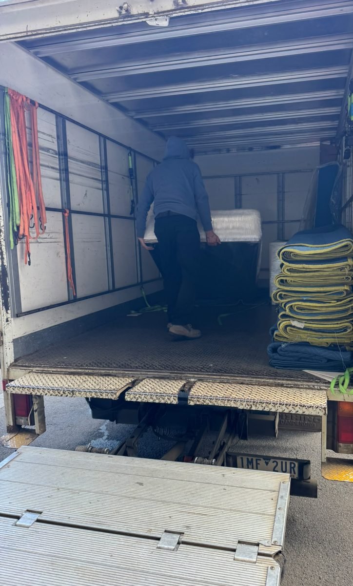 Sam's Removals truck unloading at a Melbourne CBD apartment move